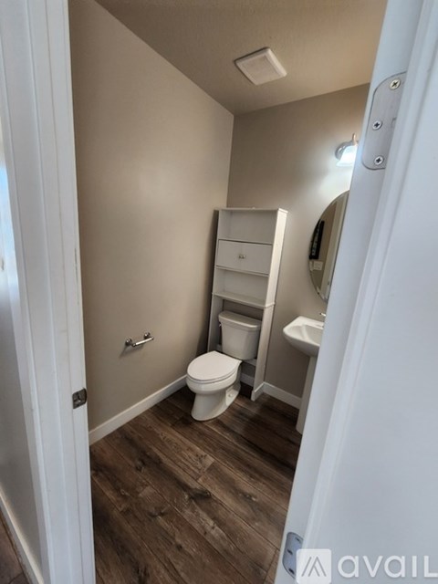 A small bathroom with a toilet and a sink.