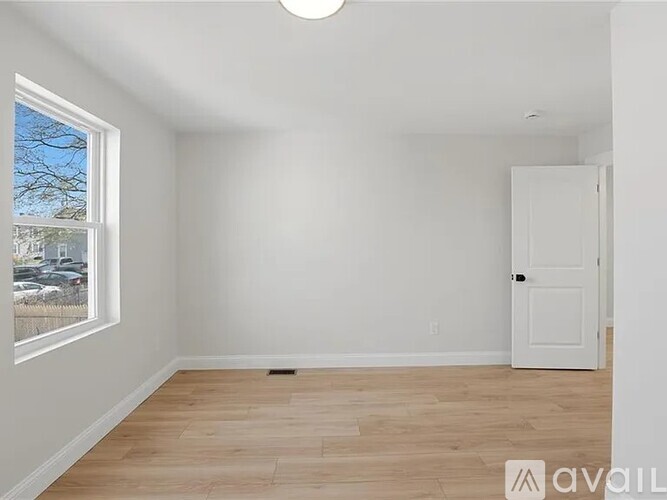 A room with a door and a window.