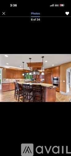A modern kitchen with wooden cabinets and a central island.