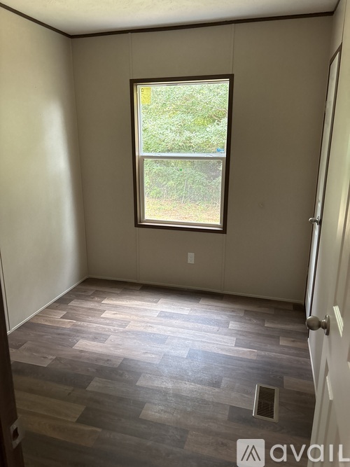 A room with a window and Avail logo.