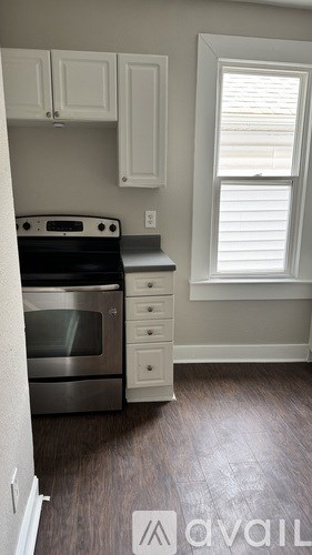 A kitchen with a stove top oven and a microwave.