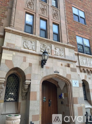 A building with a brown door and windows.