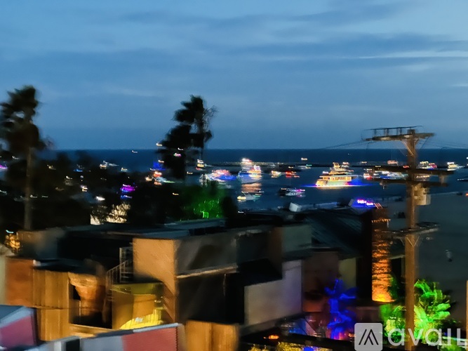 A cityscape at night with buildings and lights.