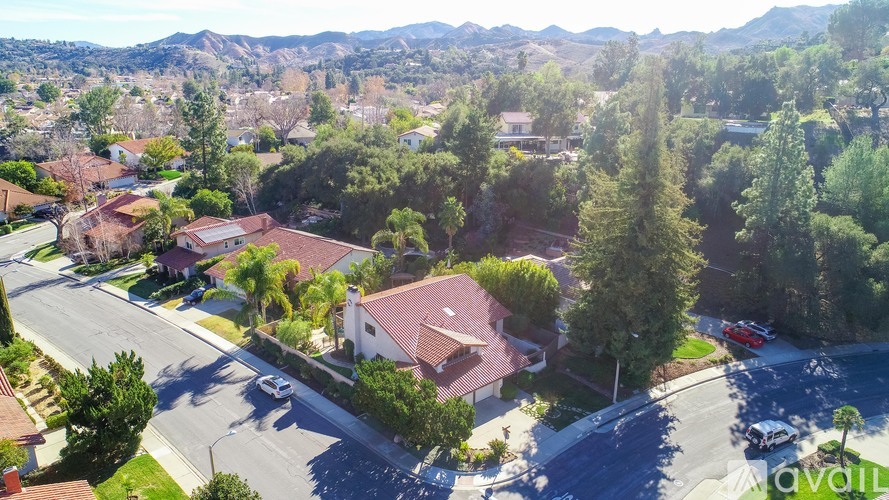A suburban neighborhood with houses and trees.