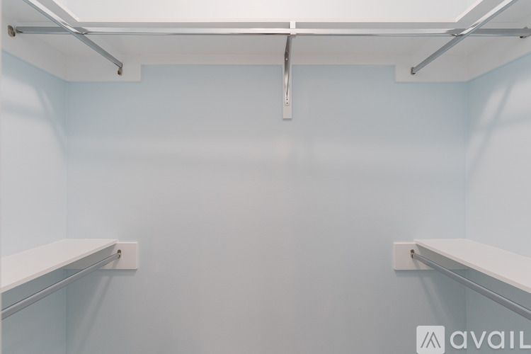 A white shelf is mounted on a wall.