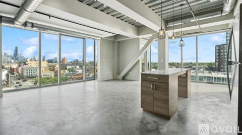 A spacious office with a view of the city skyline.