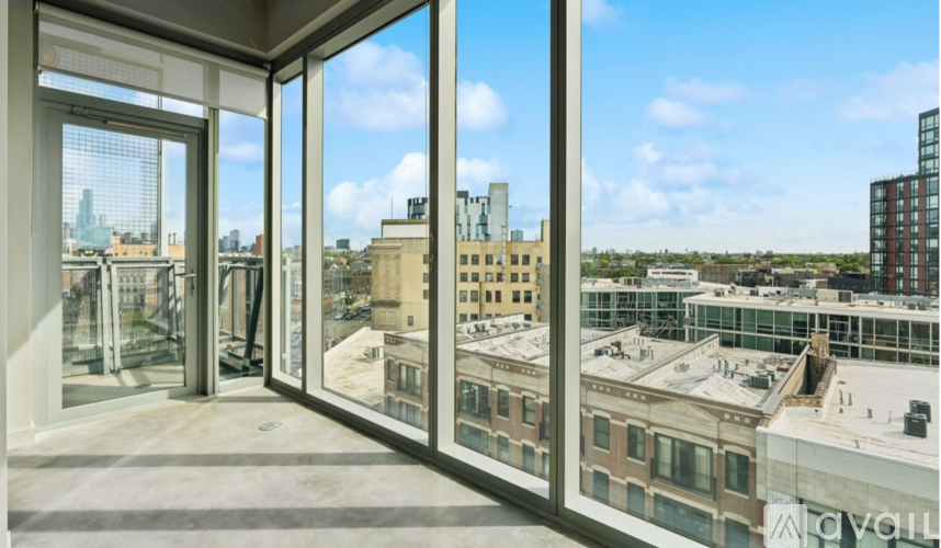 A view from a high-rise building looking out over a cityscape.