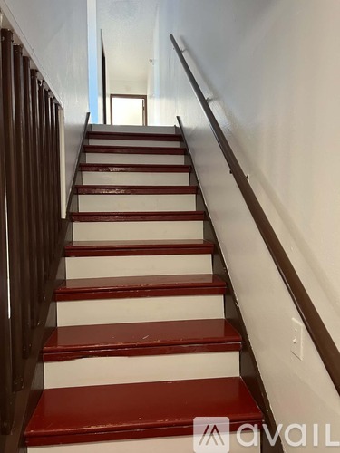 A staircase with red and white steps.