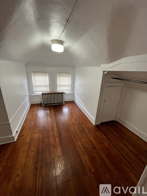 A room with wooden floors and a white ceiling.