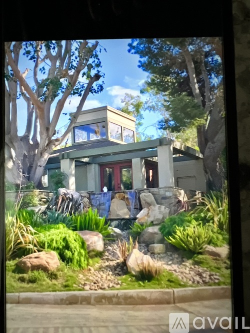 A house with a garden in front of it.