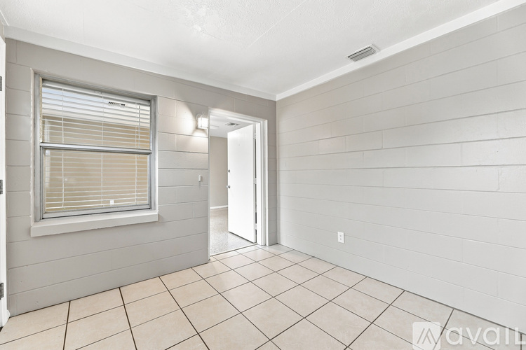 A room with a window and a door.