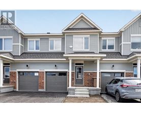 A two-story house with a grey and white exterior and a grey car parked in front.