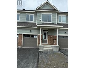 A two-story house with a garage on the first floor.