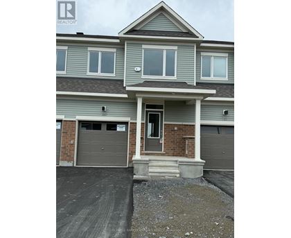 A two-story house with a garage on the first floor.