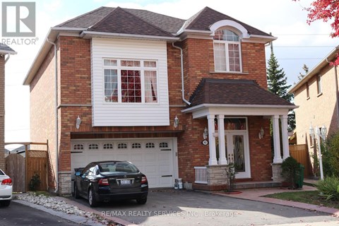 A house with a car parked in front of it.