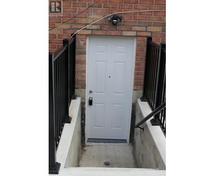 A white door is closed and has a black handle.