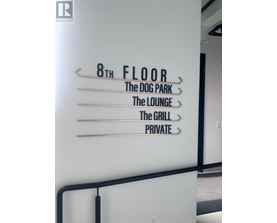 A sign for the 8th floor of a building that includes a dog park, lounge, grill, and private area.