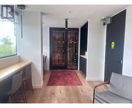 A room with a red carpet and a glass door.