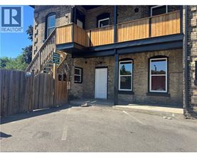 A building with a wooden fence in front of it.