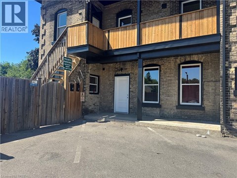 A building with a wooden fence in front of it.