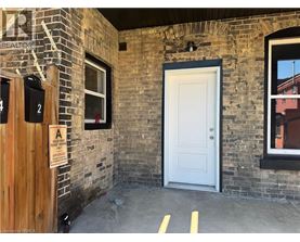 A sign on a door reads "A is for Alley.".