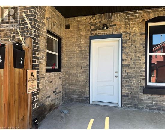 A sign on a door reads "A is for Alley.".