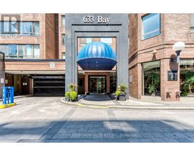 The entrance to a building with the number 633 Bay on it.
