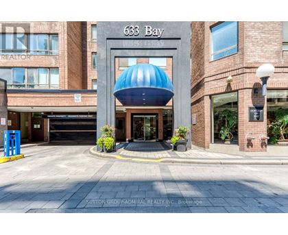 The entrance to a building with the number 633 Bay on it.