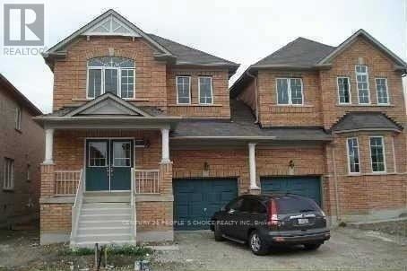 A two-story house with a car parked in front.
