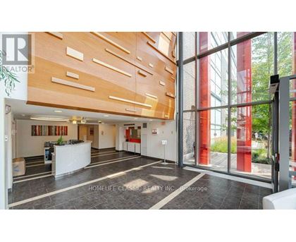 A realtor photo of a home interior with a reception desk and a large window.