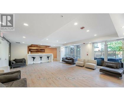 A spacious living room with a variety of seating options and a fireplace.