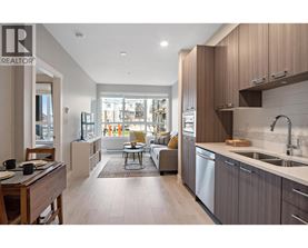 A modern kitchen with a dining table and chairs.