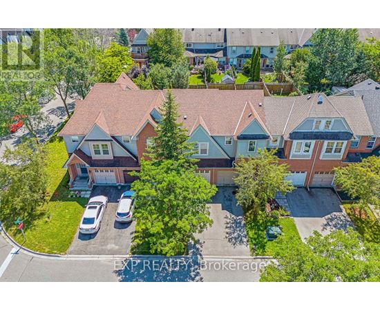 A bird's eye view of a residential area with houses and cars.