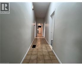 A long hallway with a door at the end.