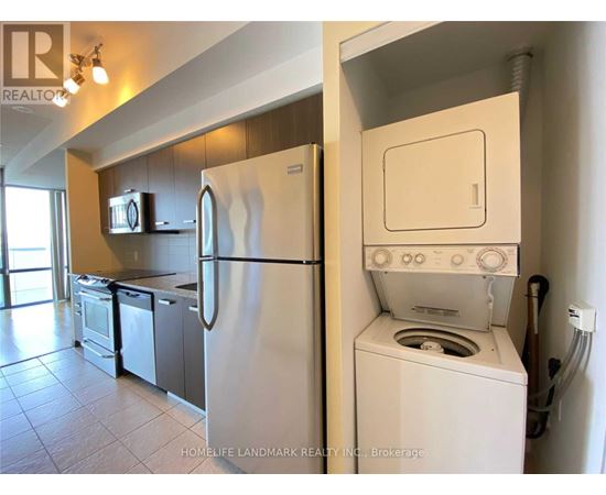 A white refrigerator and oven in a kitchen.