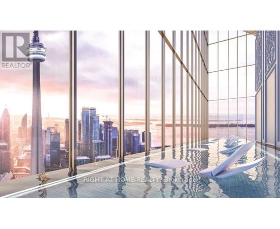 A modern indoor swimming pool with a view of the city skyline.