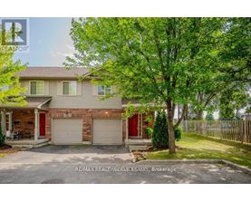 A house with a red garage door is for sale.