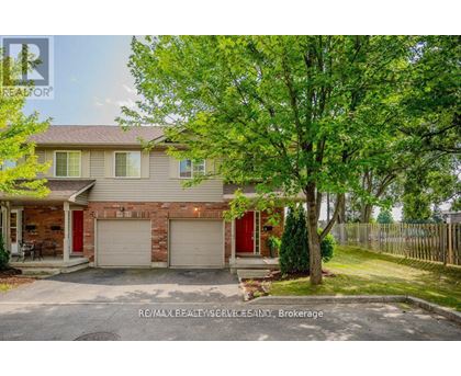 A house with a red garage door is for sale.