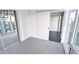 A room with a sliding door and a carpeted floor.
