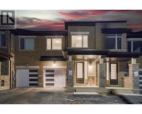 A modern two-story house with a garage is for sale.