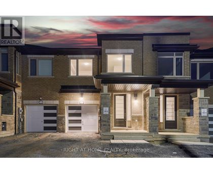 A modern two-story house with a garage is for sale.