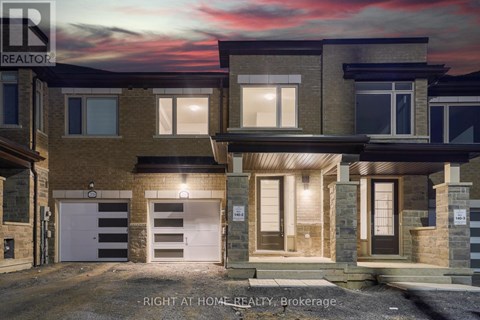 A modern two-story house with a garage is for sale.