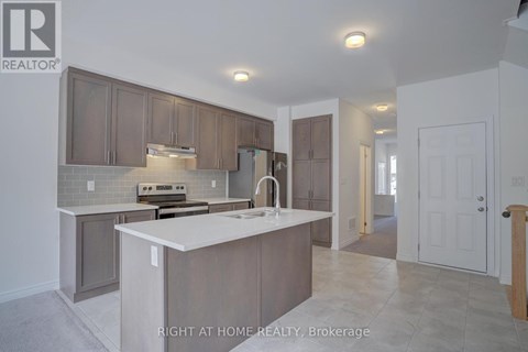 A kitchen with a white counter top and brown cabinets.