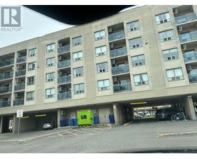 A parking garage with a sign that says REALTOR.
