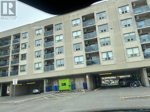 A parking garage with a sign that says REALTOR.