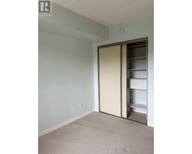 A room with a sliding door and a shelf.