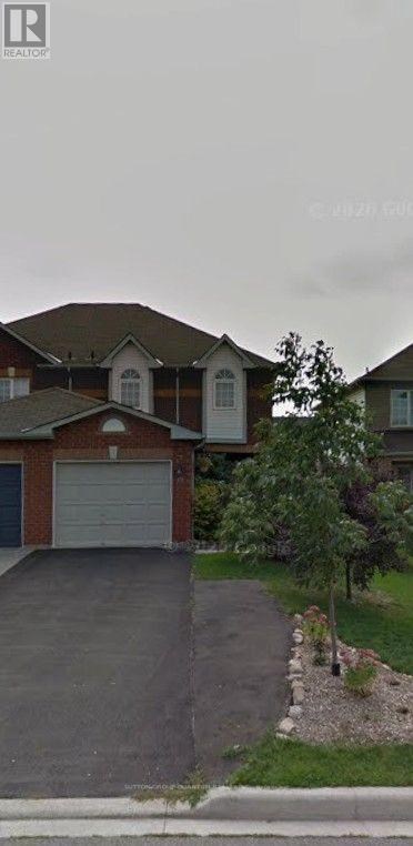 A house with a driveway and a garage door.