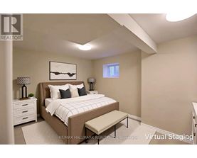 A bedroom with a bed, nightstands, and a bench.