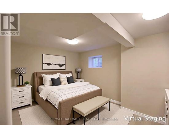 A bedroom with a bed, nightstands, and a bench.