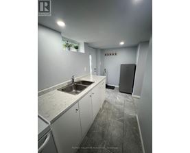 A kitchen with a sink and a dishwasher.